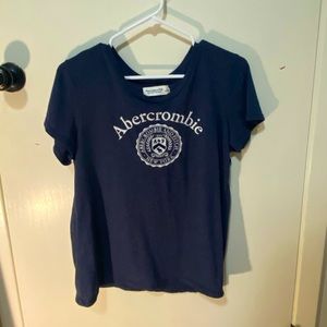 An abercrombie t-shirt with the emblem on the front.